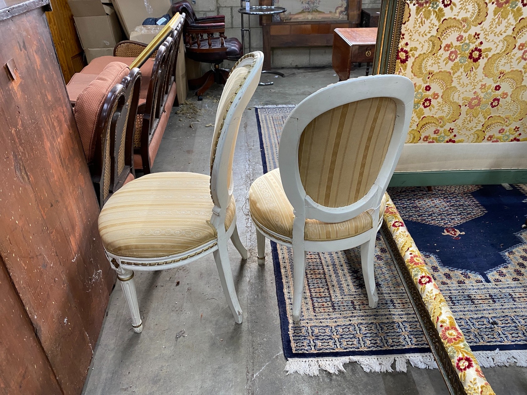 A pair of French painted side chairs, width 54cm, depth 50cm, height 99cm